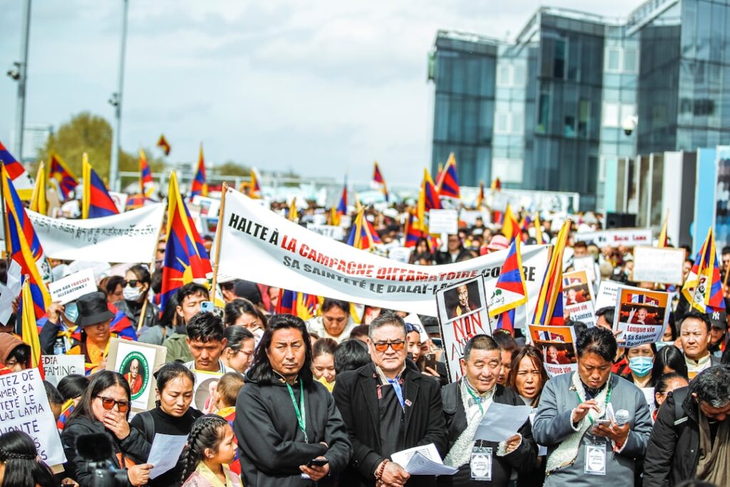a large group of people holding signs and flags