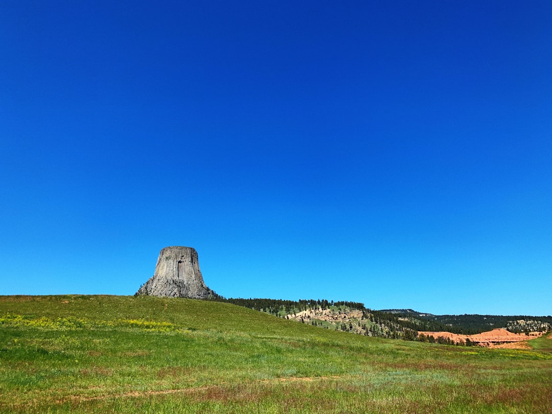 a stone structure in a field
