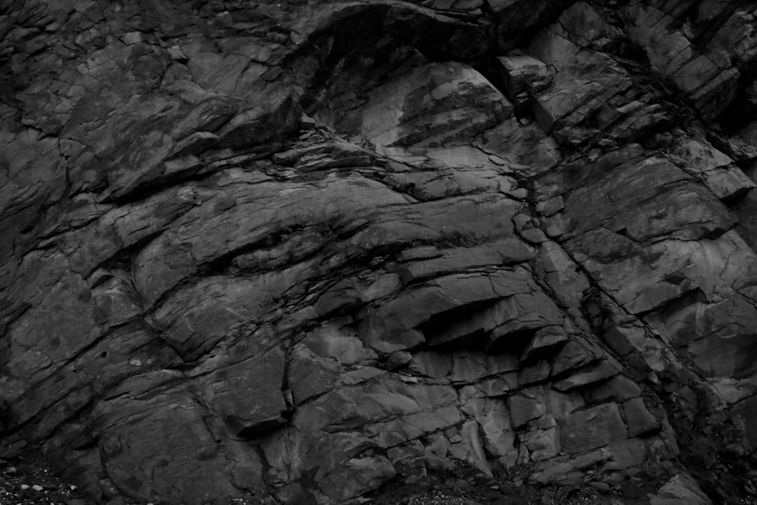 A black and white photo of a rock formation