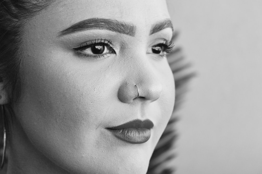 shallow focus photo of woman wearing nose hoop