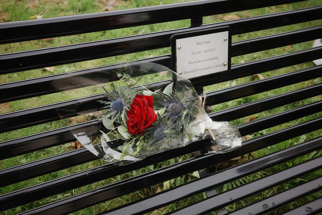 A memorial is placed on a park bench