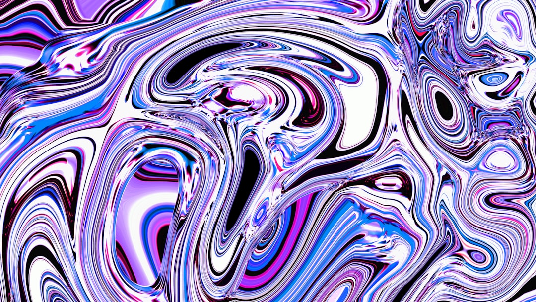 Abstract, swirling, colorful pattern in shades of purple.